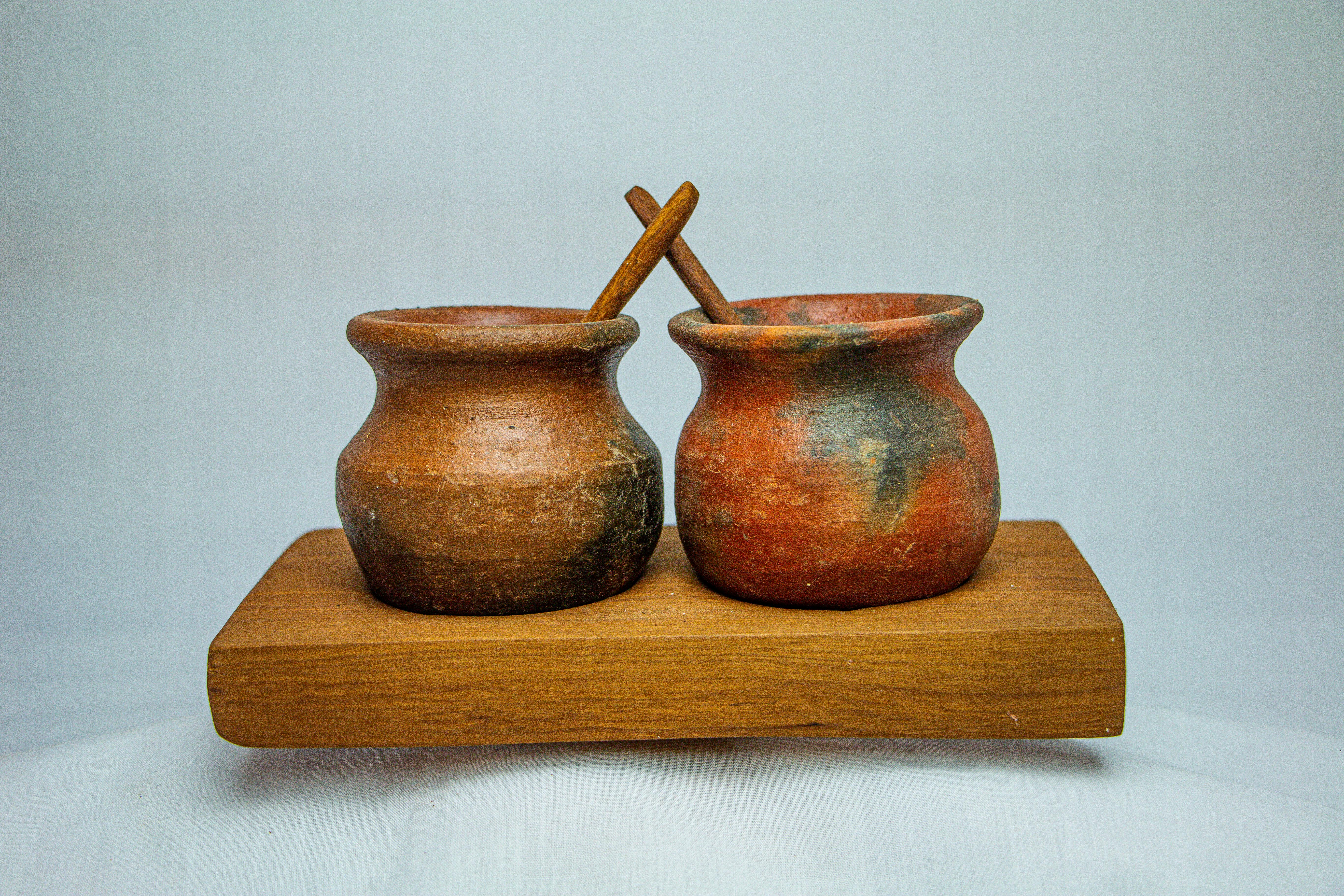 claypot with spoon on a wooden stand